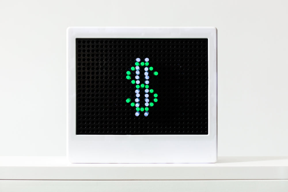 landscape image of small led light with dollar sign