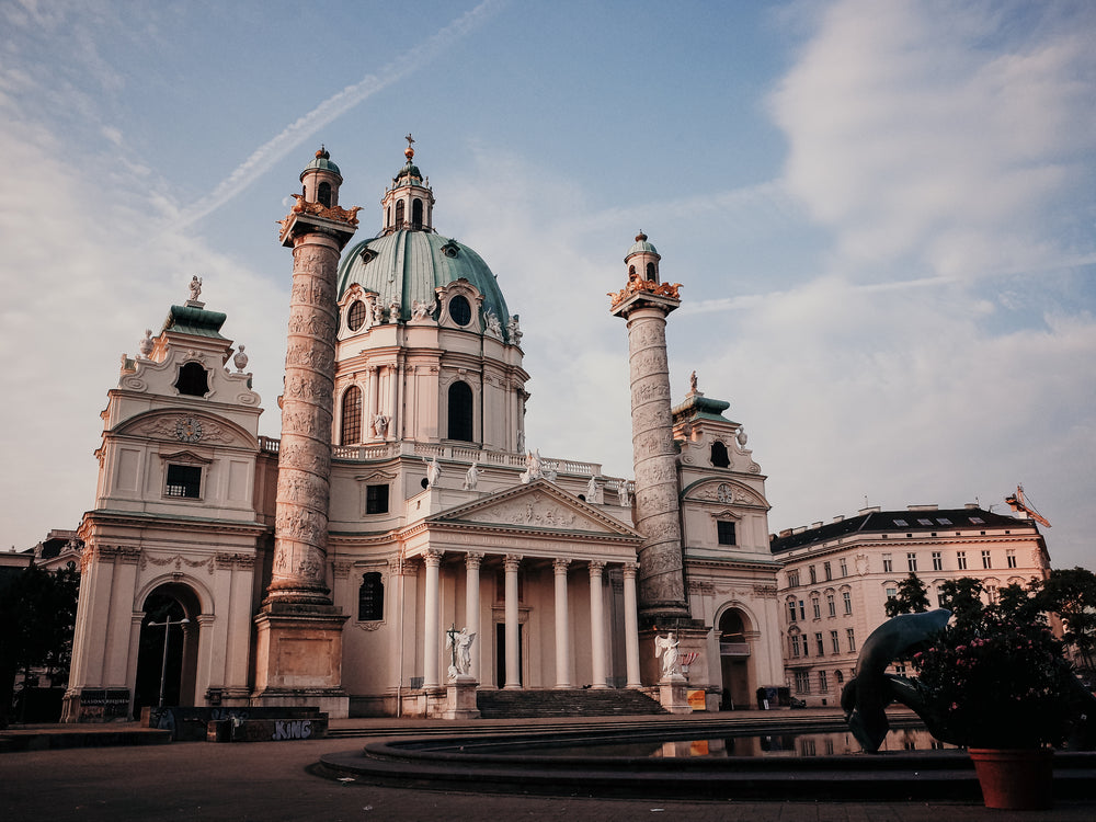 large building with circular roof and columns