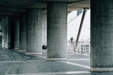 large cement pillars under cement ceiling