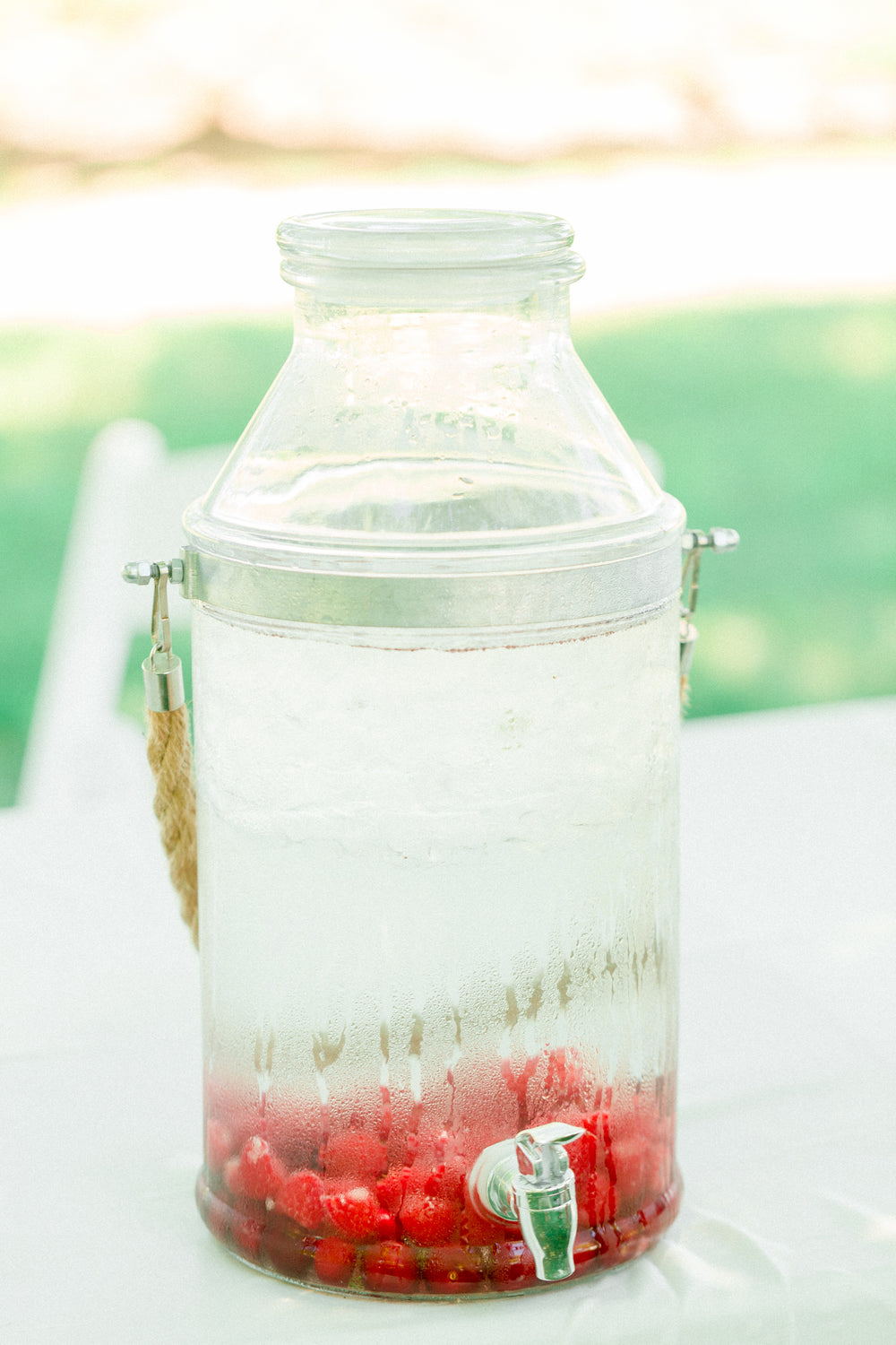 large jug of berry water on a table