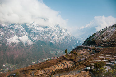 large mountains and a village in valley below