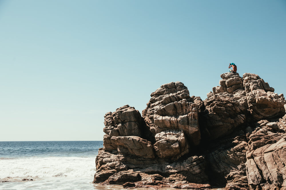 large rock face on beach