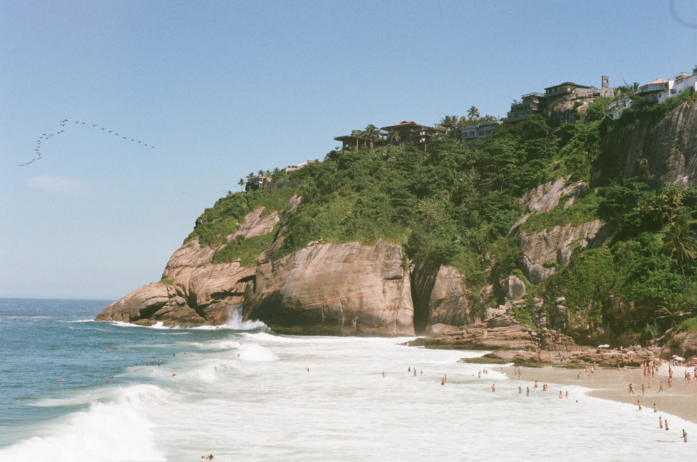 large sandy beach with white wavy water