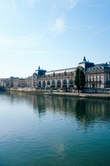 large waterfront building with arched window