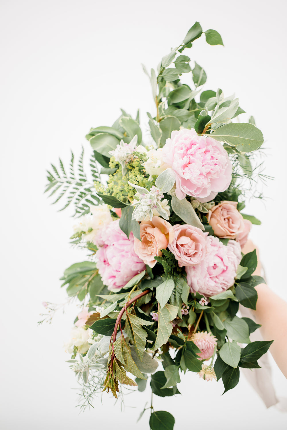large wedding bouquet held up