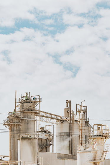 large white industrial building with tall white cylinders