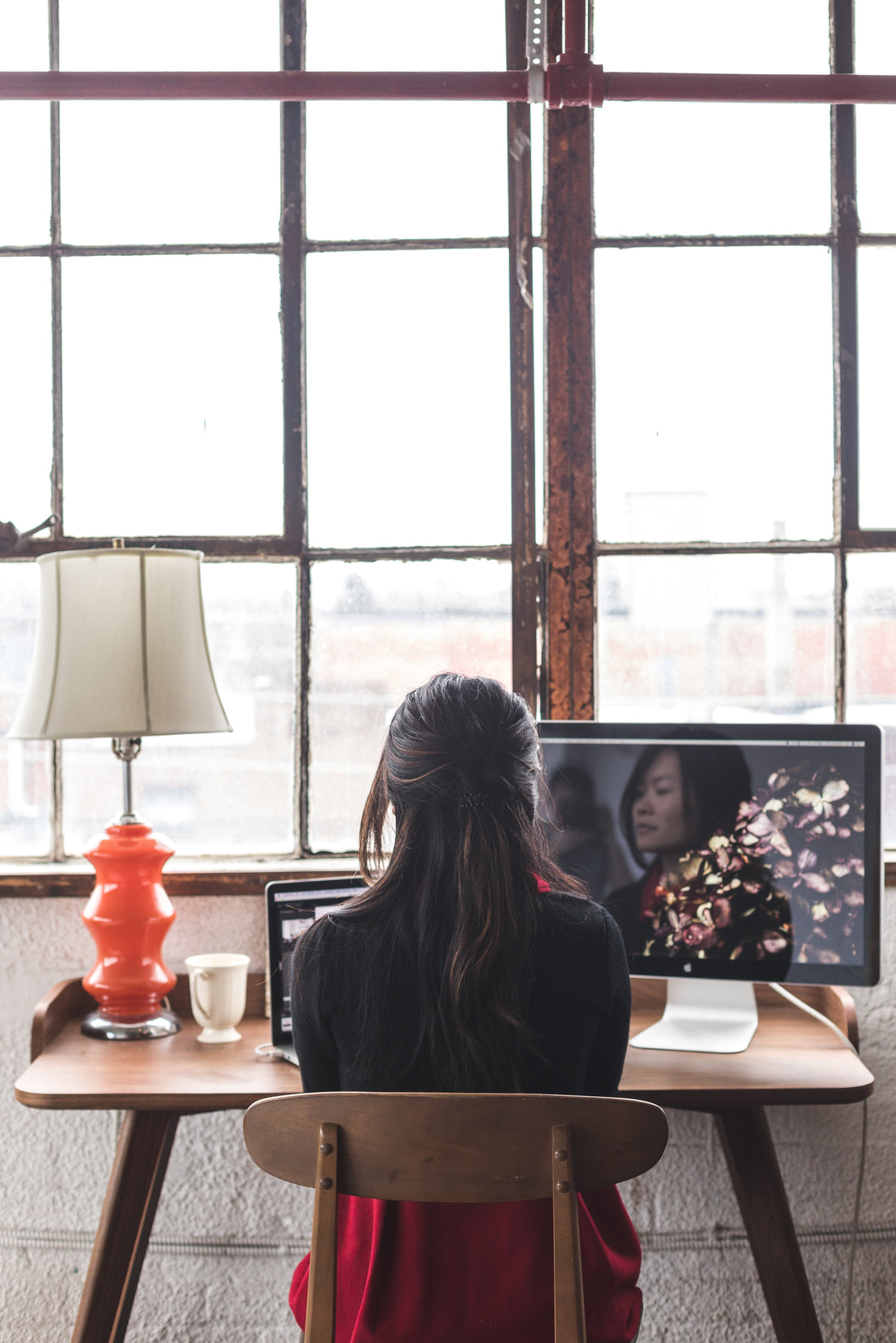 A large window flooding a workspace with natural light