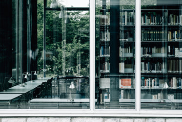 large window with books and tables inside