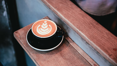 latte art in cup at cafe