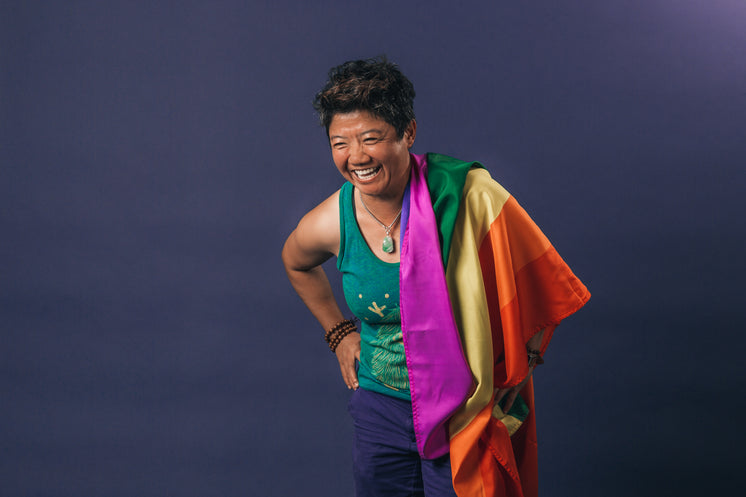 laughing-portrait-with-pride-flag.jpg?width=746&format=pjpg&exif=0&iptc=0