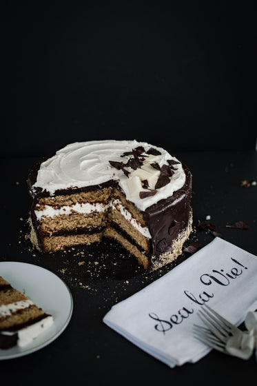 layered cake with decorative napkin