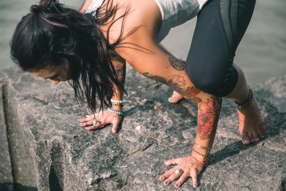 leaning into yoga on the rocks