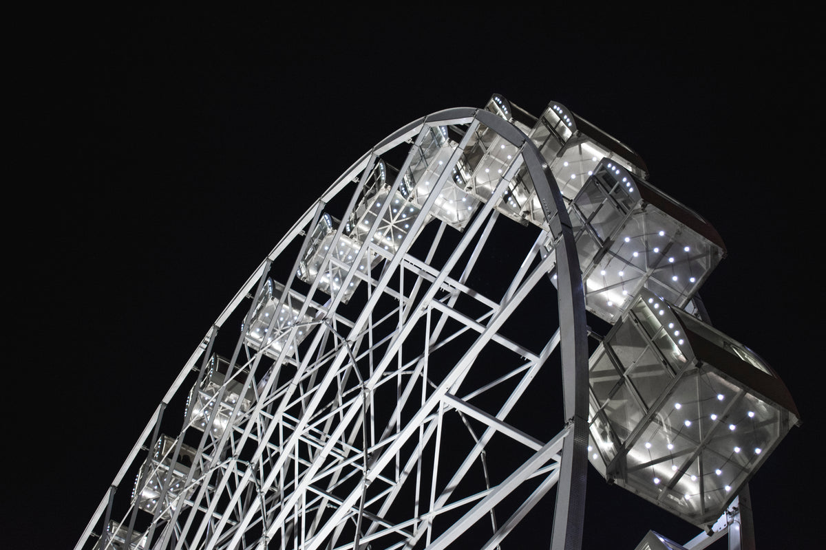 led lights glow on ferris wheel
