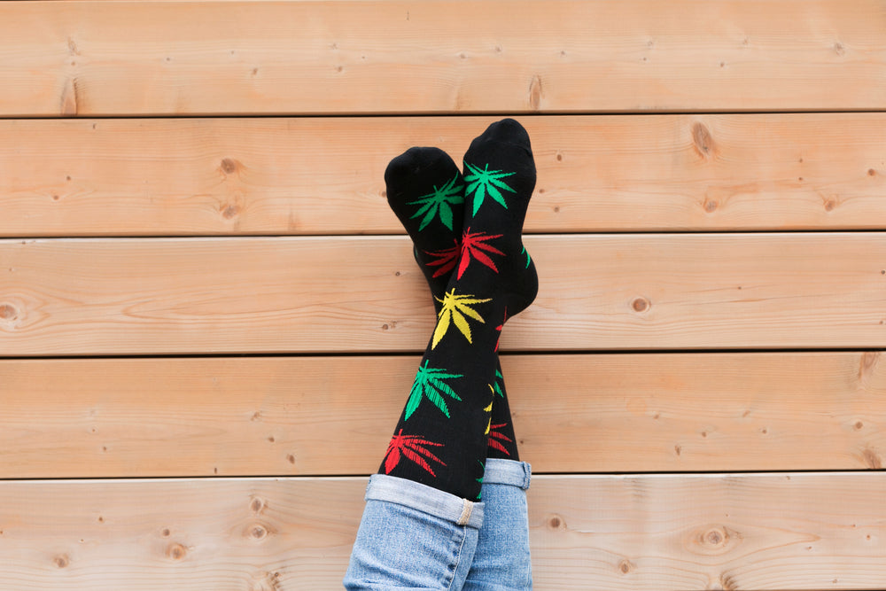 legs crossed hemp leaf socks