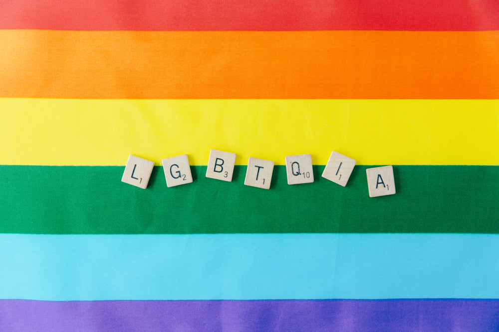 lgbtqia letters on a pride flag