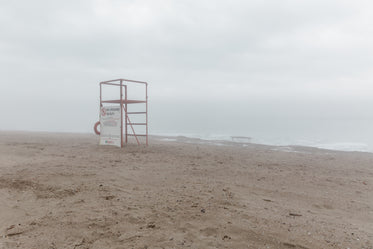 lifeguard stand on grey beach