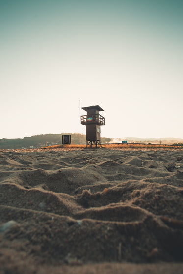 lifeguard stands on sandy beach