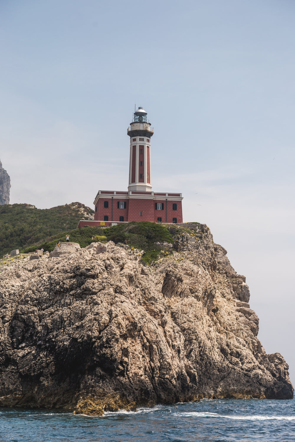 light house on rocky cliff in capri italy