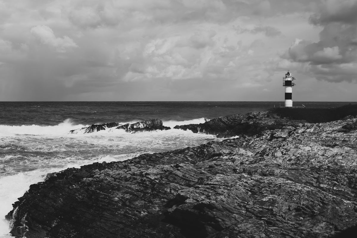 lighthouse and crashing waves
