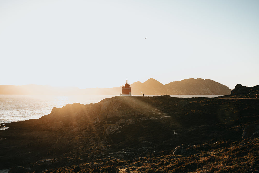 lighthouse peaks at sunset