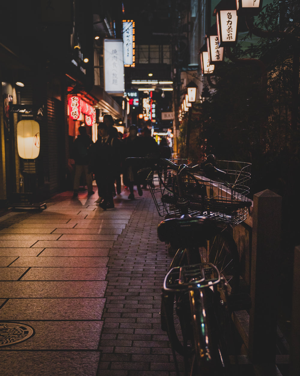 lights shine over shadowy streets