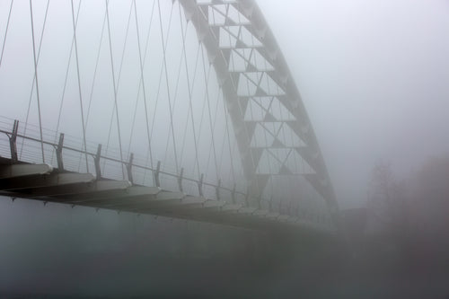 linear bridge in fog