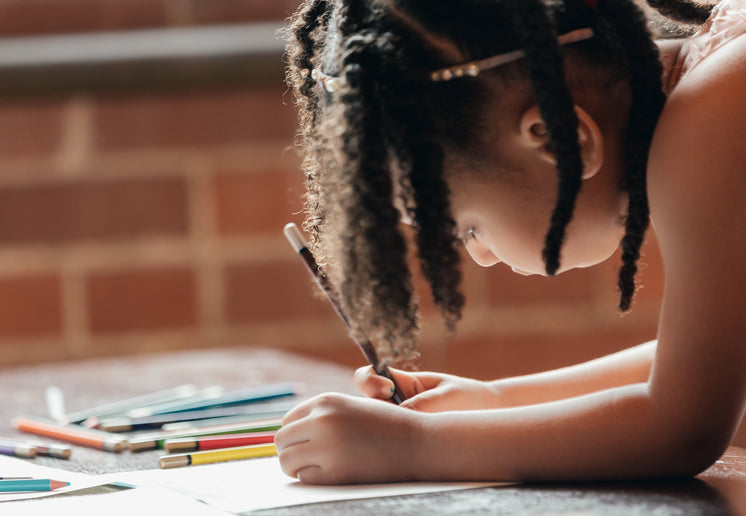 Little Girl Drawing Is Focused