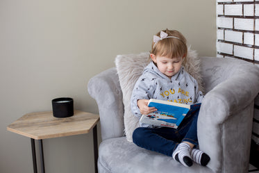 little girl in her reading chair