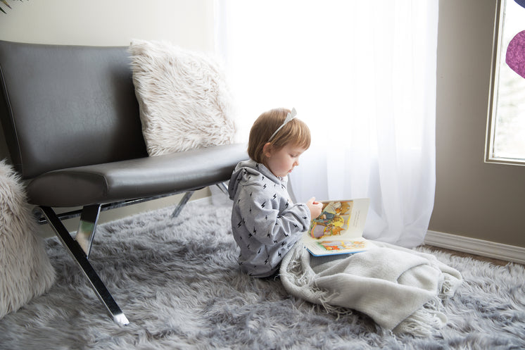little-girl-under-a-blanket-reading.jpg?
