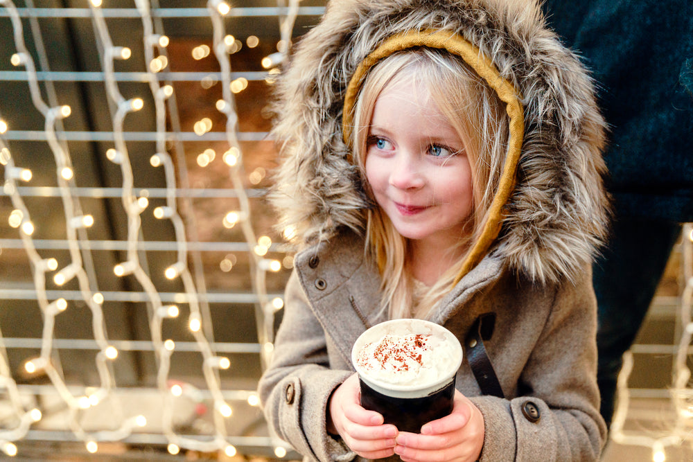 little girl with hot chocolate