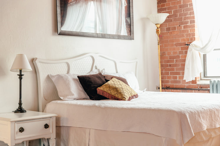 Loftstyle Bedroom With Throw Pillows