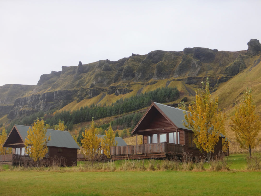 log cabins by green hills