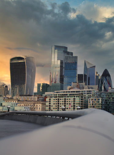 london cityscape at cloudy  sunset with glass buildings