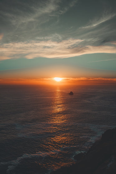 lone rock at sunset