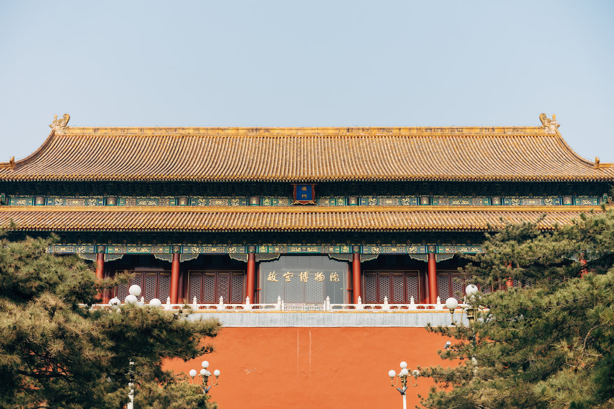 long chinese temple with golden rooftops
