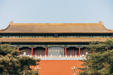 long chinese temple with golden rooftops