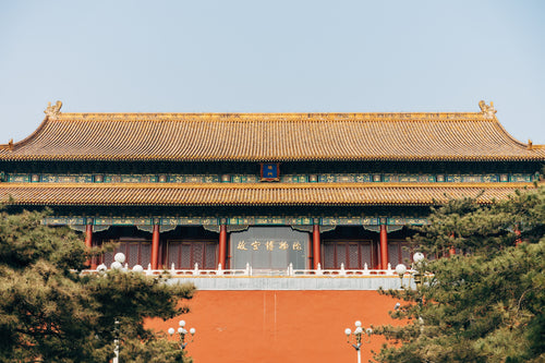long chinese temple with golden rooftops