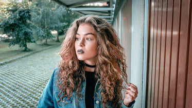 long curly hair and dark lipstick
