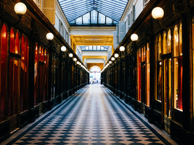 Long Hallway In Yellow And Black With Checkered Floors