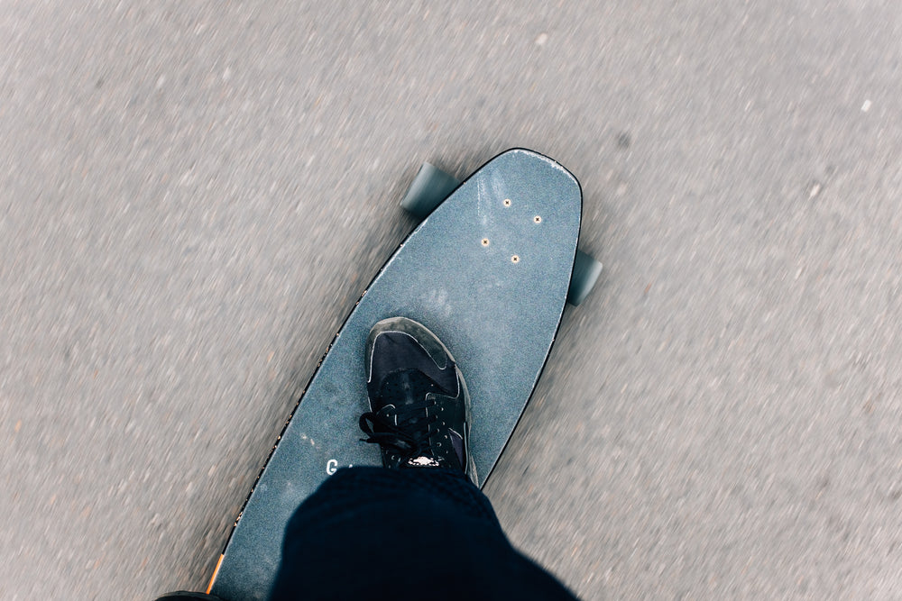 look down at beaten skateboard