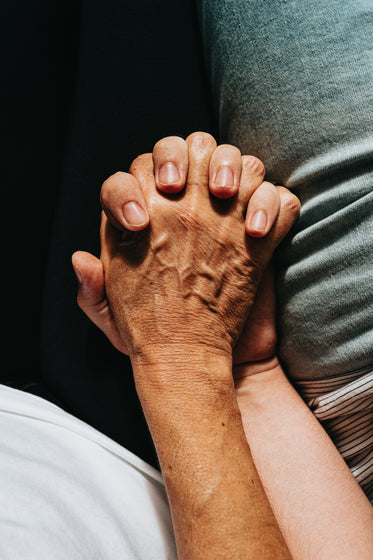 looking down at couple holding hands