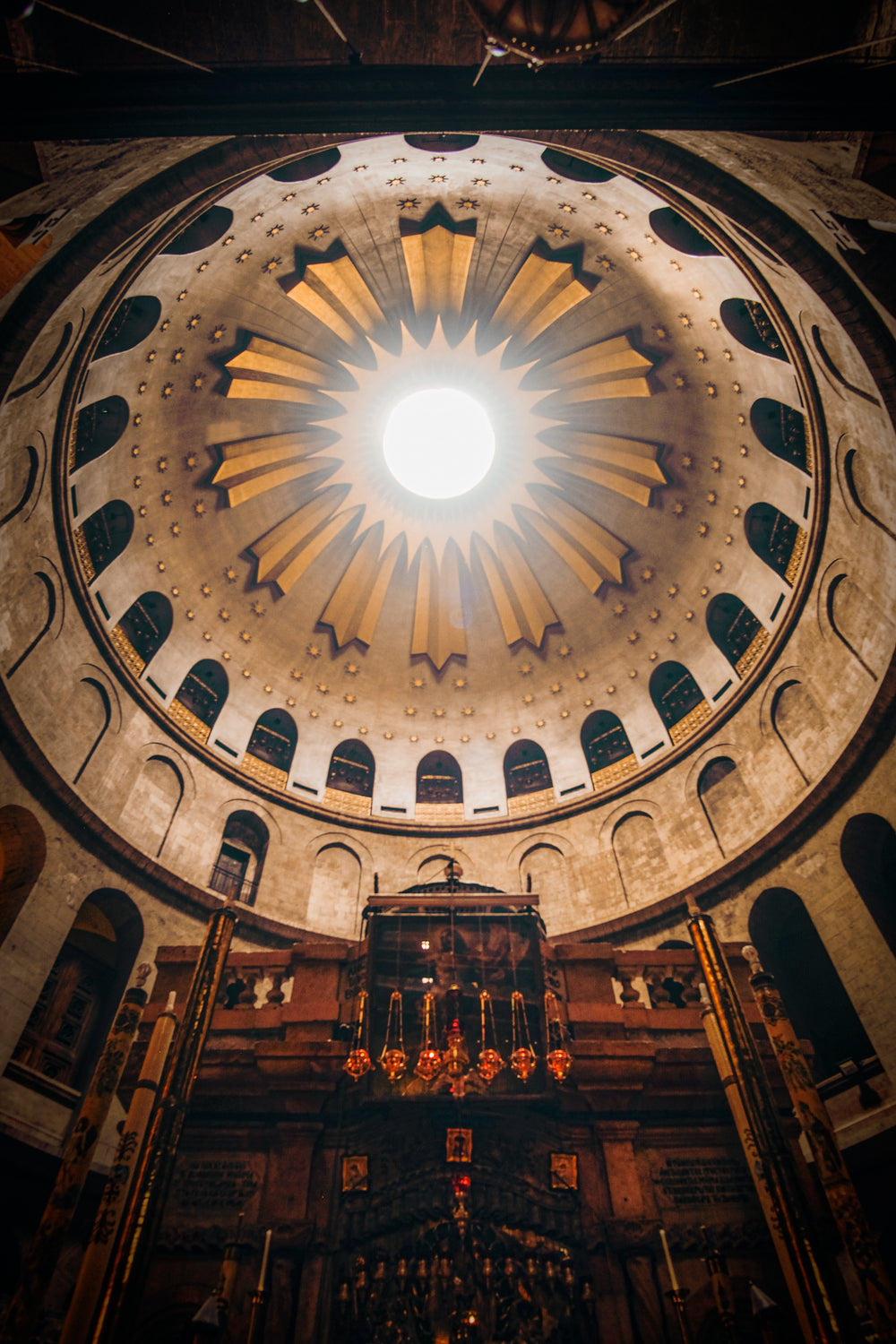 looking up at round ceiling with alcoves