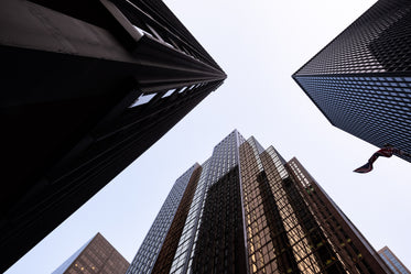 looking up at three buildings