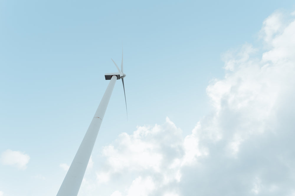 looking up at white windmill