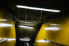 looking up at yellow walls in subway exit