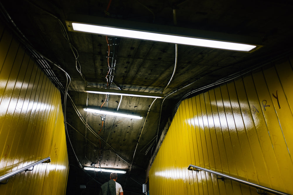 looking up at yellow walls in subway exit