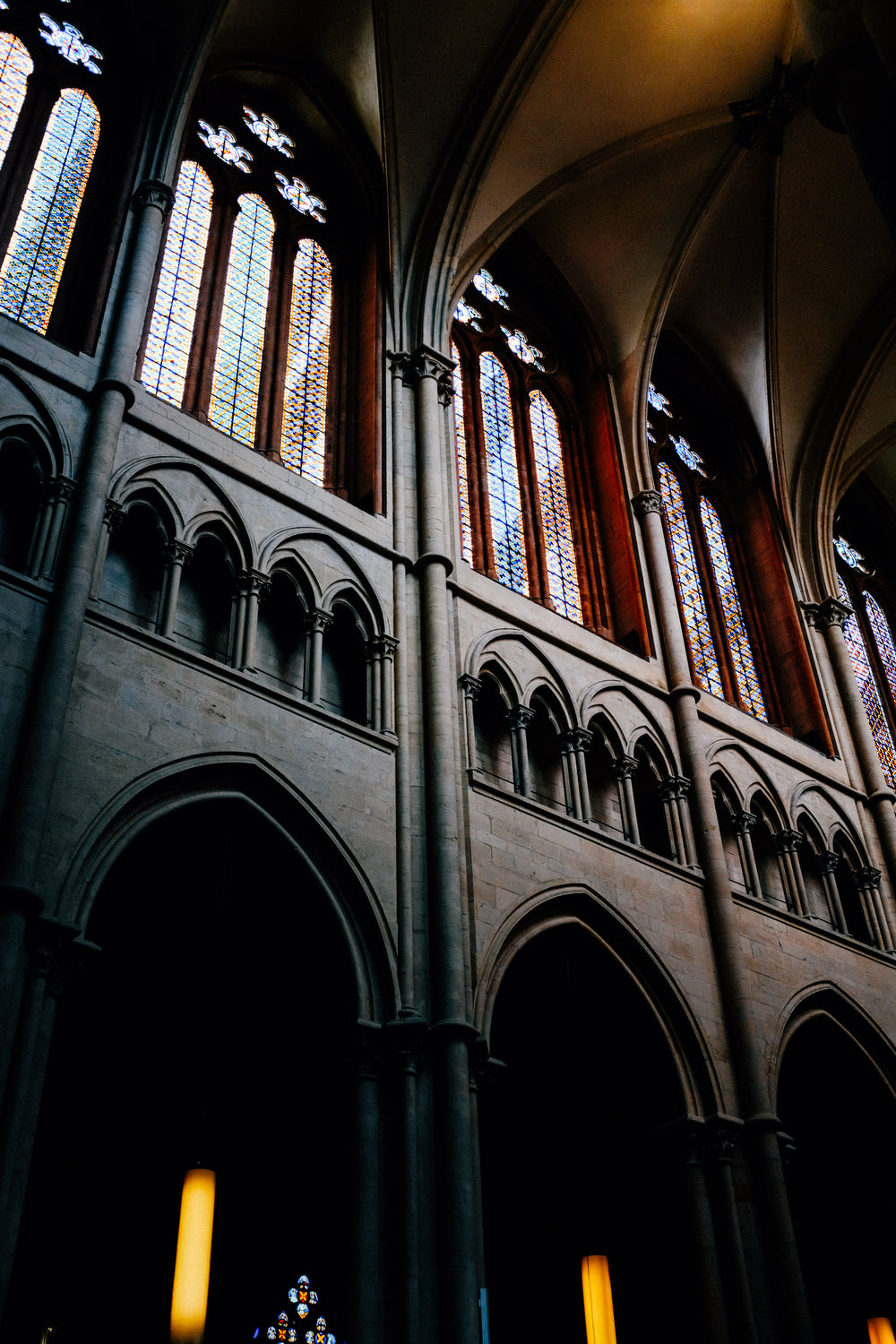 looking upwards in a building with stained glass windows