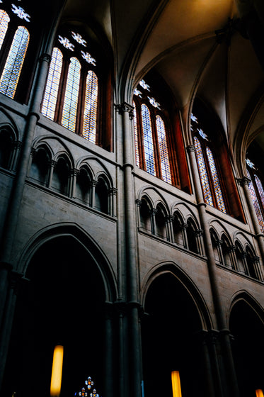 looking upwards in a building with stained glass windows