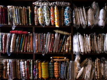 lots of hand-woven ribbon on book shelves