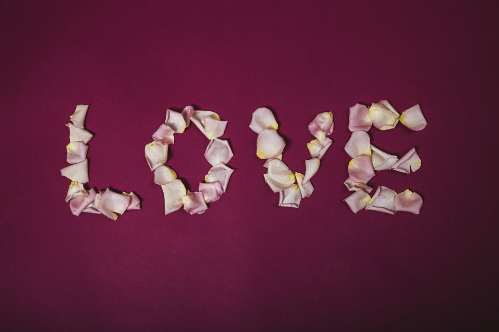 love written in rose pedals